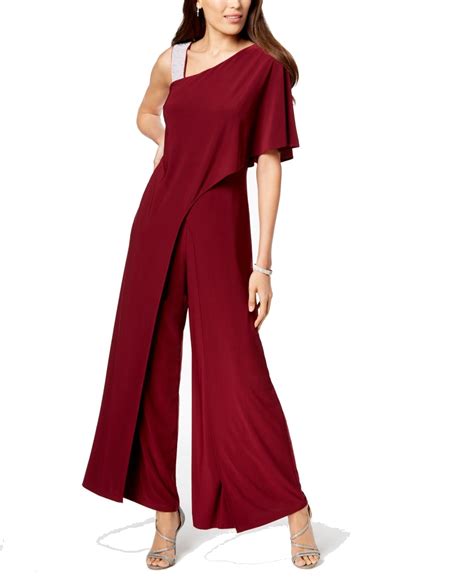 The fashionable pant suit features a jacket with shear, 34 length sleeves, elegant slacks, and a beautiful blouse with a lace neckline. . Rm richards jumpsuit